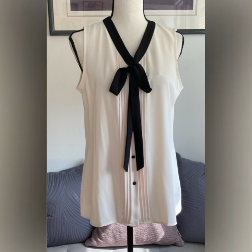 NWT Anne Klein Blouse. White.
Black tie neck, Button front closure. Size Small.